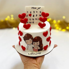 Anniversary Cake featuring a couple, held by a hand