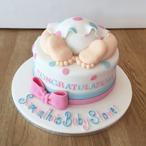 A baby shower cake beautifully decorated for the celebration.