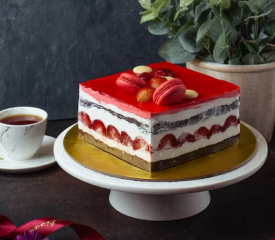 A cherry-topped premium red velvet cake in the picture